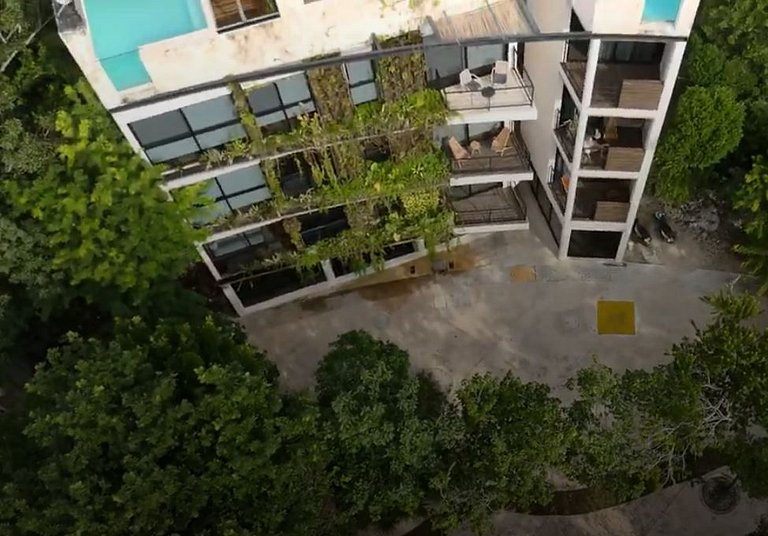 Modern building with rooftop pool and gym